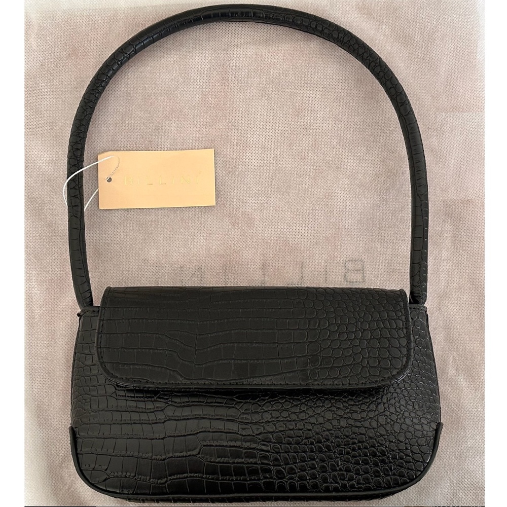 Elegant structured statement shoulder bag.